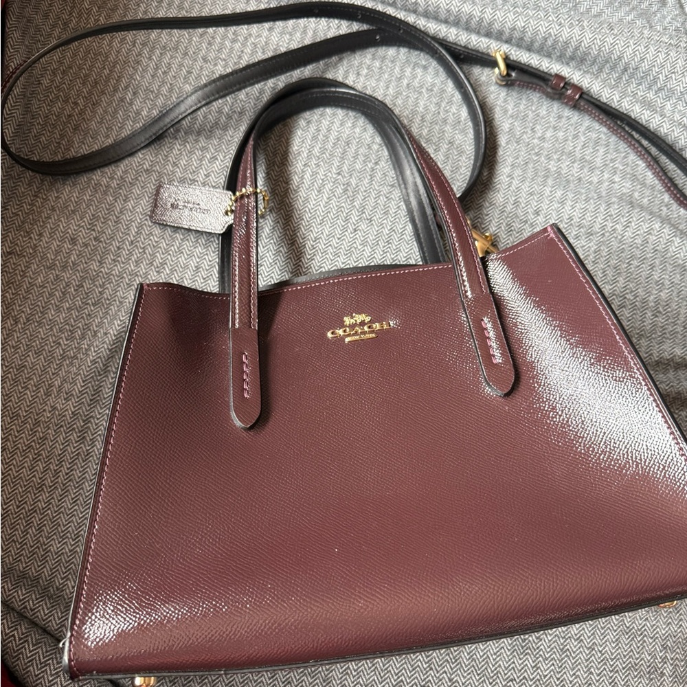 The COACH Charlie Carryall 28 (Style 31738) Paten Leather
